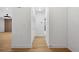 Clean and bright hallway with light wood floors and storage at 2321 Beneva Ter # 2288, Sarasota, FL 34232