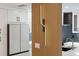 Modern kitchen with wood accent wall and lighting at 2321 Beneva Ter # 2288, Sarasota, FL 34232