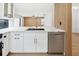 Modern kitchen with white cabinets and a marble countertop island at 2321 Beneva Ter # 2288, Sarasota, FL 34232