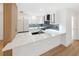 Open concept kitchen with island and hardwood floors at 2321 Beneva Ter # 2288, Sarasota, FL 34232