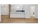 Open concept kitchen with island and hardwood floors at 2321 Beneva Ter # 2288, Sarasota, FL 34232
