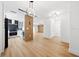 Open concept kitchen with modern appliances and wood feature wall at 2321 Beneva Ter # 2288, Sarasota, FL 34232
