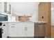 Modern kitchen with white cabinets, marble countertops, and stainless steel appliances at 2321 Beneva Ter # 2288, Sarasota, FL 34232