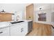Modern kitchen with white cabinets, marble countertops, and stainless steel appliances at 2321 Beneva Ter # 2288, Sarasota, FL 34232