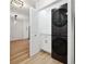 Laundry closet with stackable washer and dryer, and white shaker cabinets at 2321 Beneva Ter # 2288, Sarasota, FL 34232