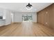 Bright living room with light wood floors and sliding glass doors leading to a patio at 2321 Beneva Ter # 2288, Sarasota, FL 34232