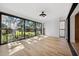 Sunroom with light wood floors and sliding glass doors at 2321 Beneva Ter # 2288, Sarasota, FL 34232