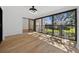 Sunroom with light wood floors and sliding glass doors at 2321 Beneva Ter # 2288, Sarasota, FL 34232