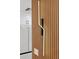 Modern wall sconce with linear design, mounted on wood paneling at 2321 Beneva Ter # 2288, Sarasota, FL 34232