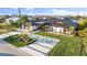 Luxury home with modern design, metal roof, and landscaped grounds at 2350 Via Venice, Punta Gorda, FL 33950