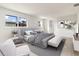 Main bedroom with a gray upholstered bed and bench at 2350 Via Venice, Punta Gorda, FL 33950