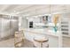 Spacious kitchen with white cabinets, quartz countertops, and stainless steel appliances at 2350 Via Venice, Punta Gorda, FL 33950