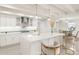 Modern white kitchen with breakfast bar and high end finishes at 2350 Via Venice, Punta Gorda, FL 33950