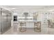 Modern white kitchen with island and stainless steel appliances at 2350 Via Venice, Punta Gorda, FL 33950