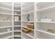 Large walk-in pantry with ample shelving and storage space at 2350 Via Venice, Punta Gorda, FL 33950