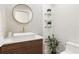 Modern powder room featuring a sleek sink and floating shelves at 2350 Via Venice, Punta Gorda, FL 33950