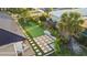 Aerial view of a backyard putting green with stone pathway at 2350 Via Venice, Punta Gorda, FL 33950