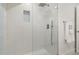 Clean and spacious shower with glass enclosure and blue tile accents at 2350 Via Venice, Punta Gorda, FL 33950