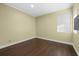 A vacant bedroom with wood floors and natural light at 2500 Jamaica St, Sarasota, FL 34231