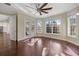 Sun-filled room with floor-to-ceiling windows and access to an outdoor pool area at 2500 Jamaica St, Sarasota, FL 34231