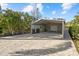 The paved parking area features a detached covered carport at 2500 Jamaica St, Sarasota, FL 34231