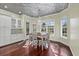 Dining room features a chandelier, natural light, and views of the outdoors at 2500 Jamaica St, Sarasota, FL 34231