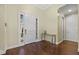 Bright and airy foyer with gleaming hardwood floors and modern glass table at 2500 Jamaica St, Sarasota, FL 34231