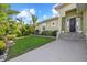 Charming home with a green lawn, stone accented landscaping, and a welcoming entrance at 2500 Jamaica St, Sarasota, FL 34231
