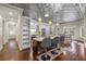 Modern kitchen with stainless steel appliances, a large island with barstool seating, and adjacent dining area at 2500 Jamaica St, Sarasota, FL 34231