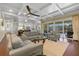 Spacious living room with access to a private lanai and an open layout leading to the kitchen at 2500 Jamaica St, Sarasota, FL 34231