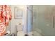 Bathroom features a walk-in shower, toilet and coral decor at 307 Timberlake Dr # 307, Bradenton, FL 34210