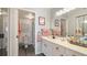 Clean bathroom with double vanity, walk-in shower, and coral decor at 307 Timberlake Dr # 307, Bradenton, FL 34210
