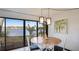 Bright dining area with lake view and modern light fixtures at 307 Timberlake Dr # 307, Bradenton, FL 34210