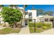 Inviting condo building exterior with lush landscaping and walkway at 307 Timberlake Dr # 307, Bradenton, FL 34210
