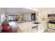 Updated kitchen with white cabinets, stainless steel appliances, and breakfast bar at 307 Timberlake Dr # 307, Bradenton, FL 34210