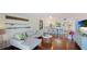 Spacious living area featuring hardwood floors, sectional sofa and flat-screen TV at 307 Timberlake Dr # 307, Bradenton, FL 34210
