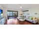 Bright living room with water views, comfy sectional sofa, and hardwood floors at 307 Timberlake Dr # 307, Bradenton, FL 34210
