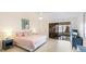 Main bedroom with king-size bed, water views and light flooring at 307 Timberlake Dr # 307, Bradenton, FL 34210