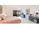 Spacious main bedroom with king bed, dresser, and sliding glass doors at 307 Timberlake Dr # 307, Bradenton, FL 34210