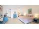 King-size bed, dresser, and calming decor in this main bedroom at 307 Timberlake Dr # 307, Bradenton, FL 34210