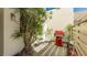 Private patio with red grill and tropical plants at 307 Timberlake Dr # 307, Bradenton, FL 34210