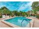 Inviting community pool with patio and plenty of lounge chairs at 307 Timberlake Dr # 307, Bradenton, FL 34210