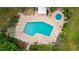 Community pool with surrounding lounge chairs and patio at 307 Timberlake Dr # 307, Bradenton, FL 34210