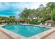 Sparkling community pool with plenty of lounge chairs at 307 Timberlake Dr # 307, Bradenton, FL 34210