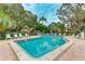 Relaxing community pool area with surrounding lush landscape at 307 Timberlake Dr # 307, Bradenton, FL 34210