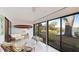 Relaxing sunroom with lake view and wicker furniture at 307 Timberlake Dr # 307, Bradenton, FL 34210