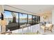 Spacious sunroom with a view of the lake and comfy seating at 307 Timberlake Dr # 307, Bradenton, FL 34210