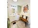 Clean bathroom with bench and decorative art at 3214 Pink Oak Ter, Sarasota, FL 34237