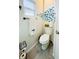 Small bathroom with toilet and fun fish wall art at 3214 Pink Oak Ter, Sarasota, FL 34237