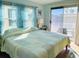 King-size bed and private access to the deck at 3214 Pink Oak Ter, Sarasota, FL 34237